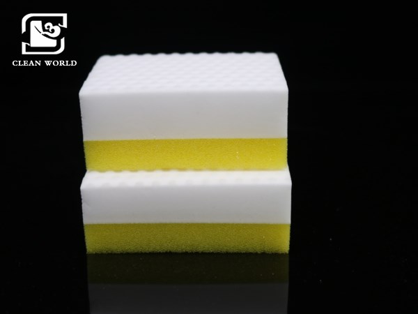 white and yellow melamine foam cleaning sponge on bathroom