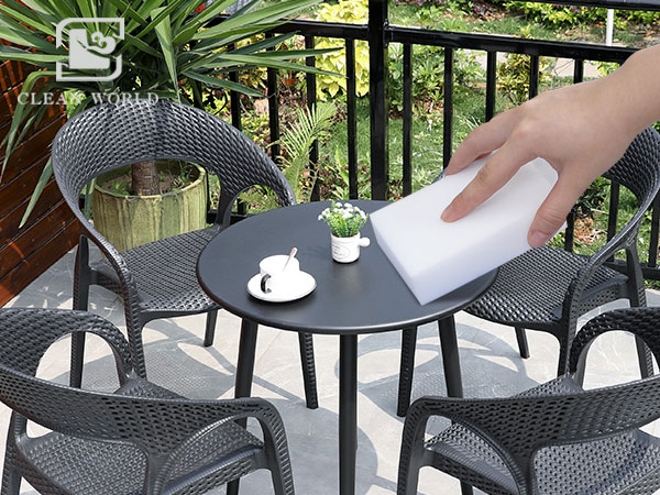 Melamine foam sponge on plastic patio furniture cleaning